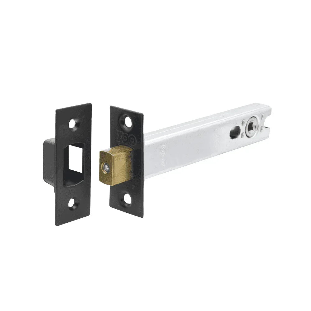 Brass and steel flush bolt door lock with black mounting plates, isolated on white background