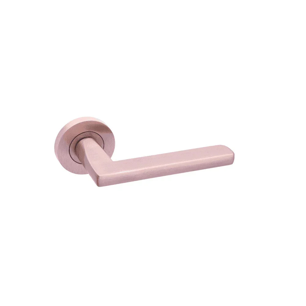 Satin rose gold door handle with round backplate, modern lever style