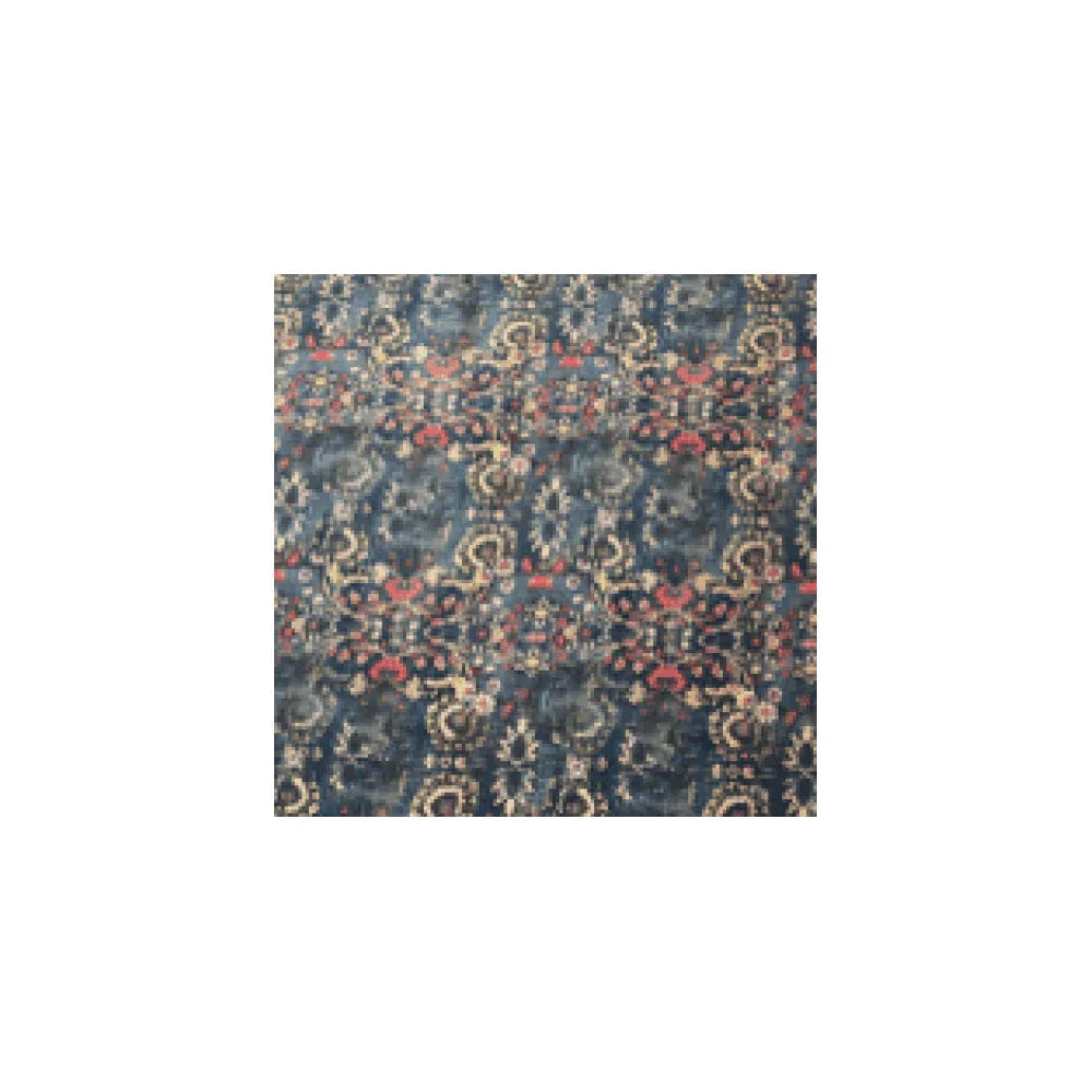 Blue patterned area rug with intricate floral design and hints of red and beige