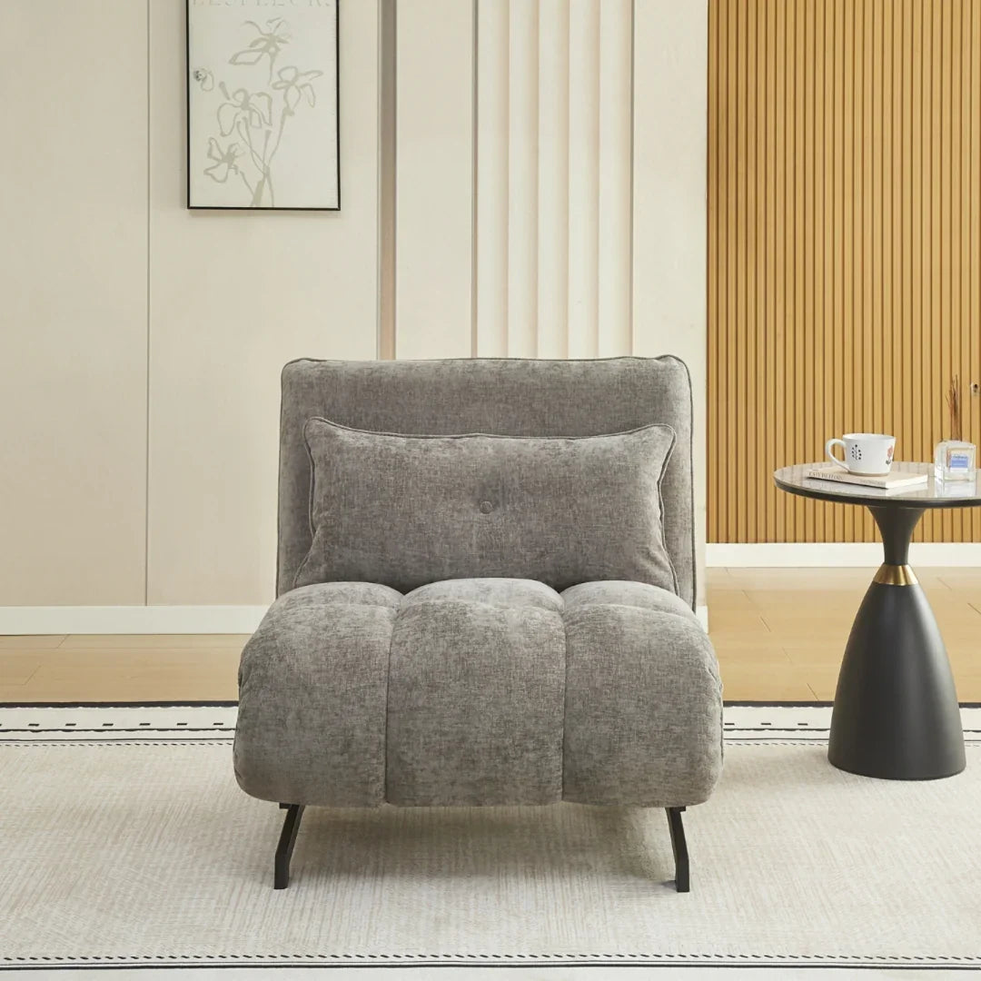 Tucker single sofa bed in grey fabric with cushion, shown in modern living room setting