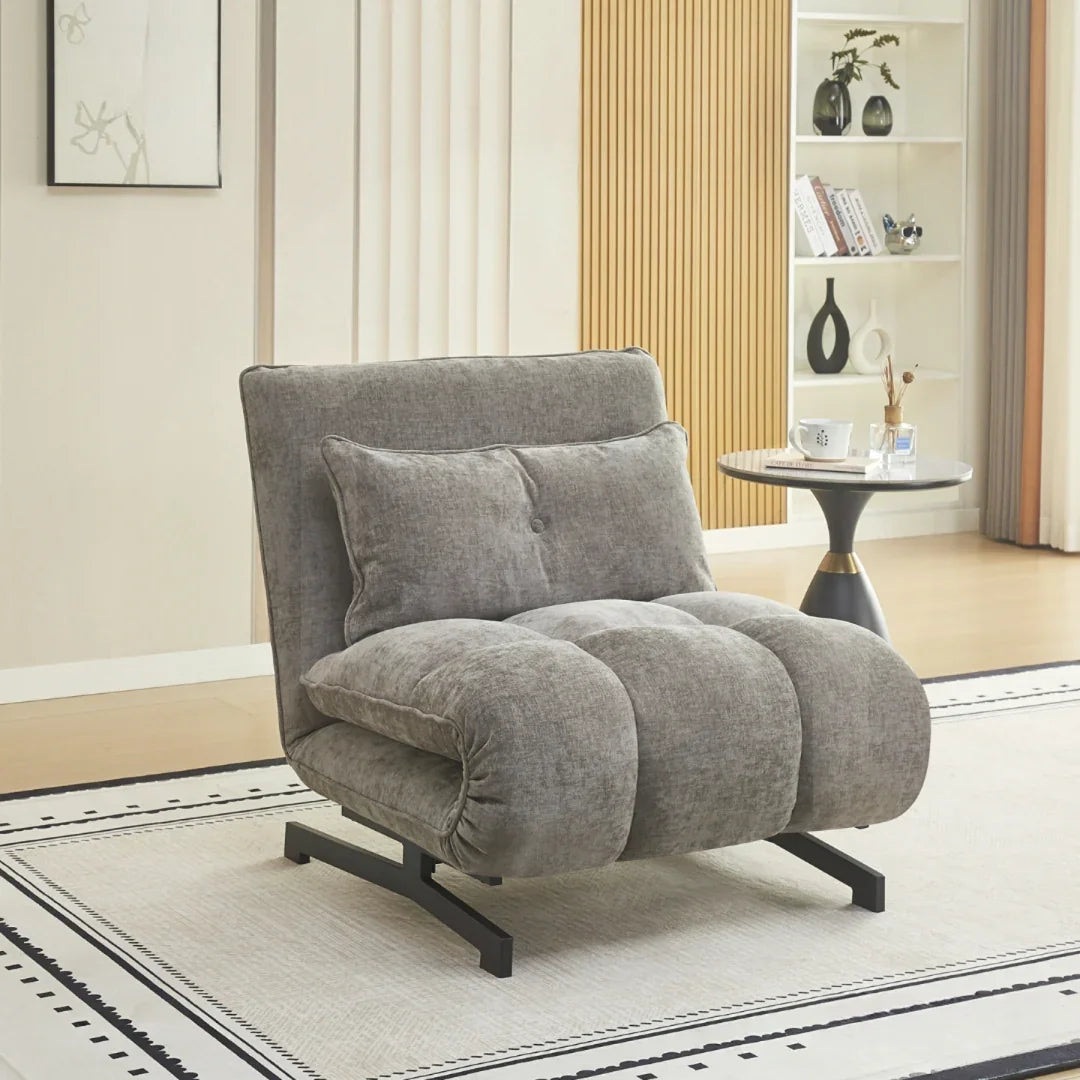 Tucker single sofa bed in grey stone fabric with cushion, set on light rug in modern living room