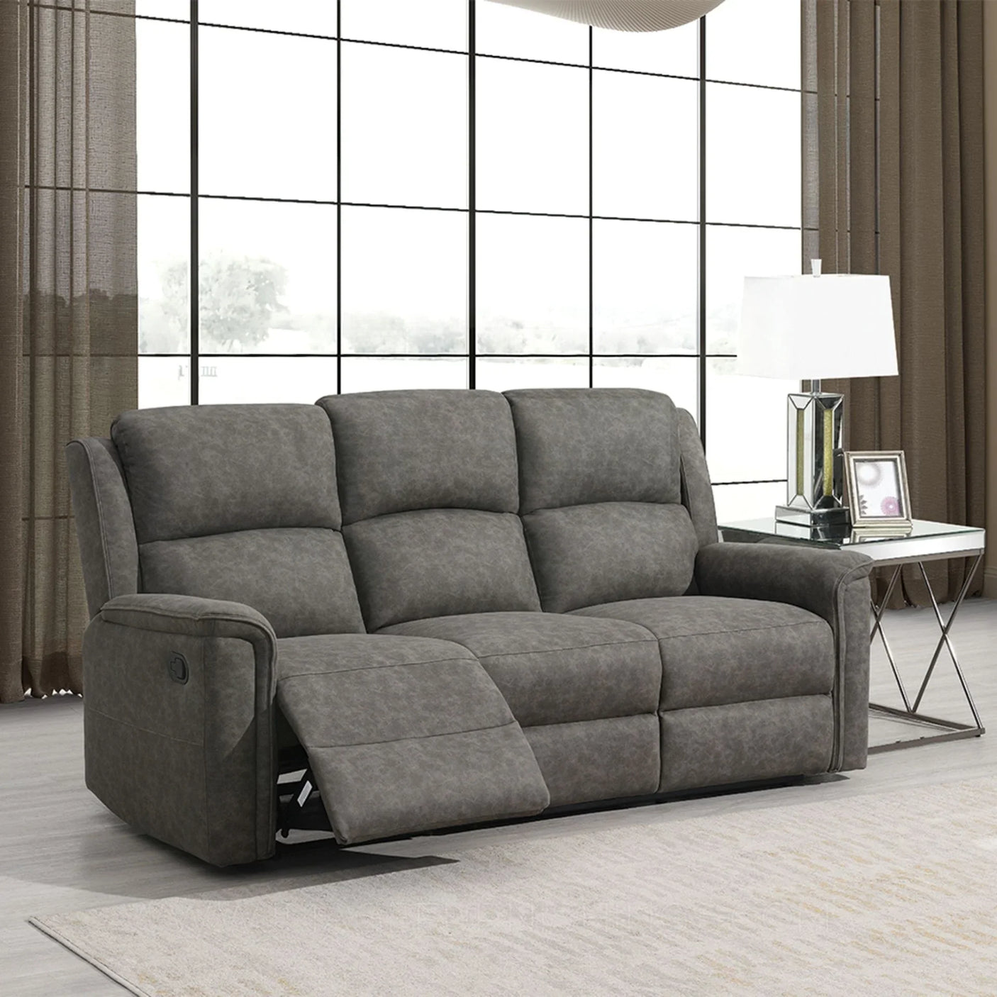 Grey fabric three seater recliner sofa in modern living room with large window