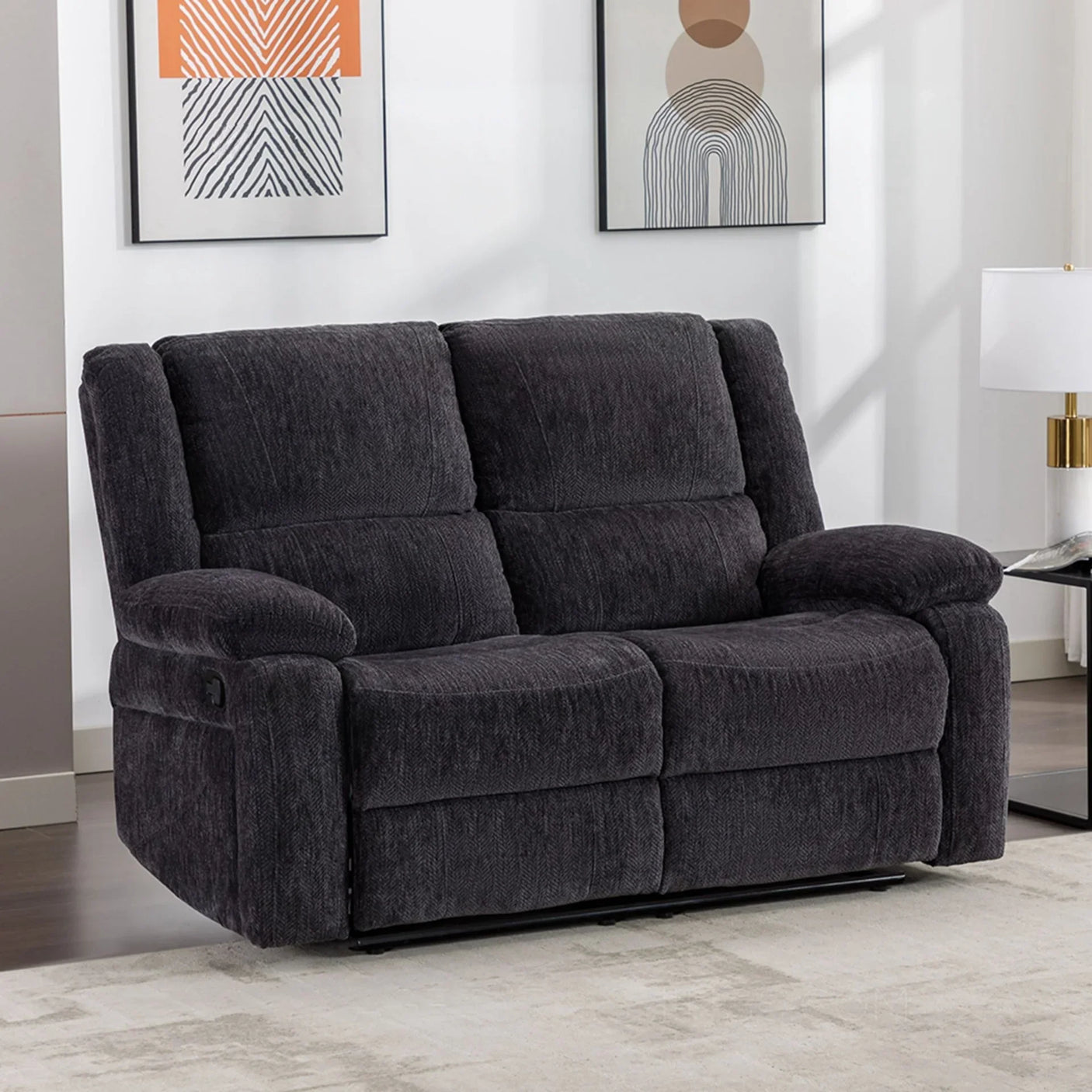 Charcoal fabric recliner sofa with plush cushions in a modern living room setting