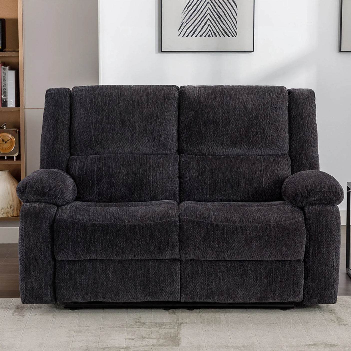 Charcoal fabric recliner sofa with high back and padded armrests in living room setting