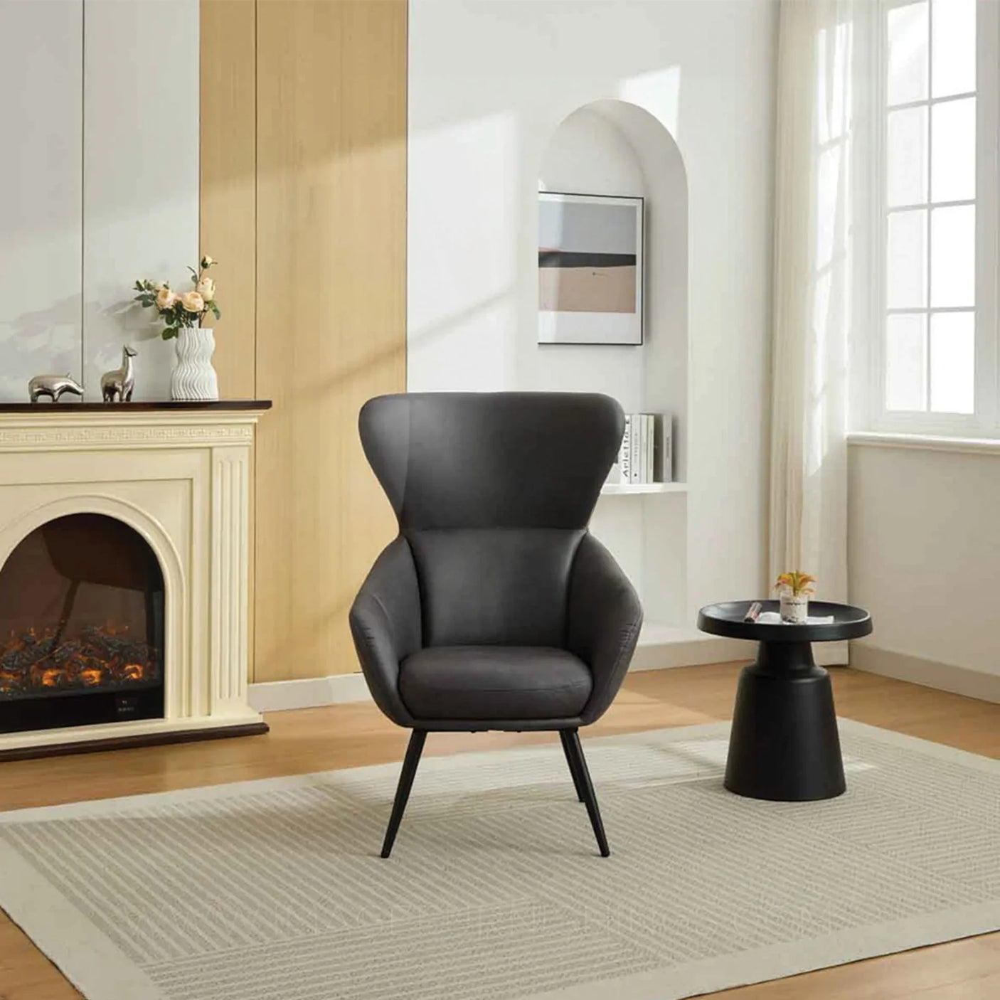 Graphite accent chair with high back and slim black legs in modern living room setting