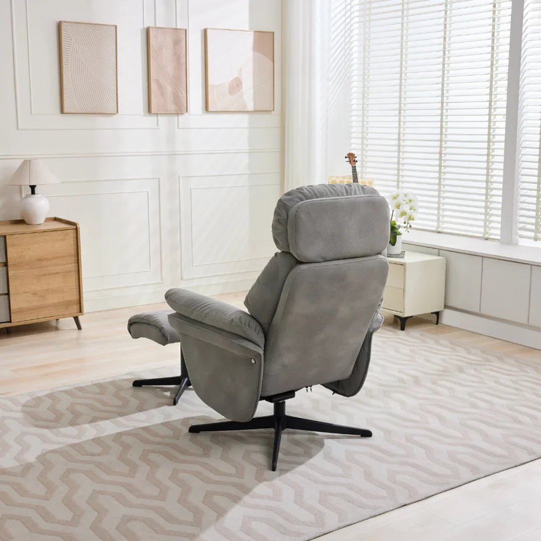 Light grey swivel leisure chair with footstool and black base in modern living room
