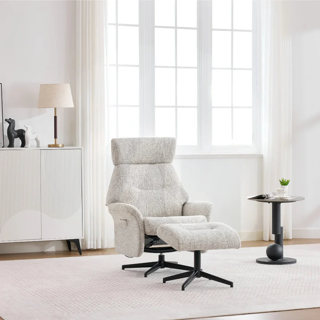 Beige swivel chair and matching footstool with metal base in bright living room setting