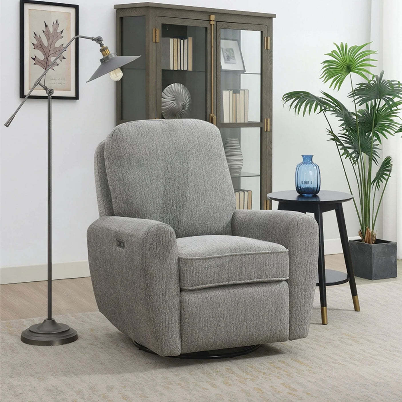 Grey swivel accent chair with plush upholstery in a modern living room setting