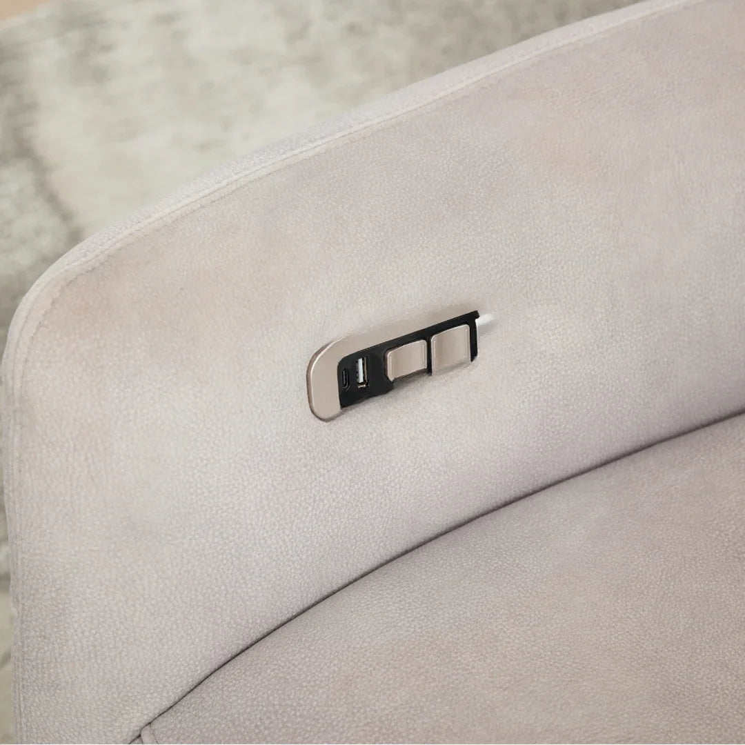 Close up of oyster swivel chair showing USB port and control buttons on fabric armrest