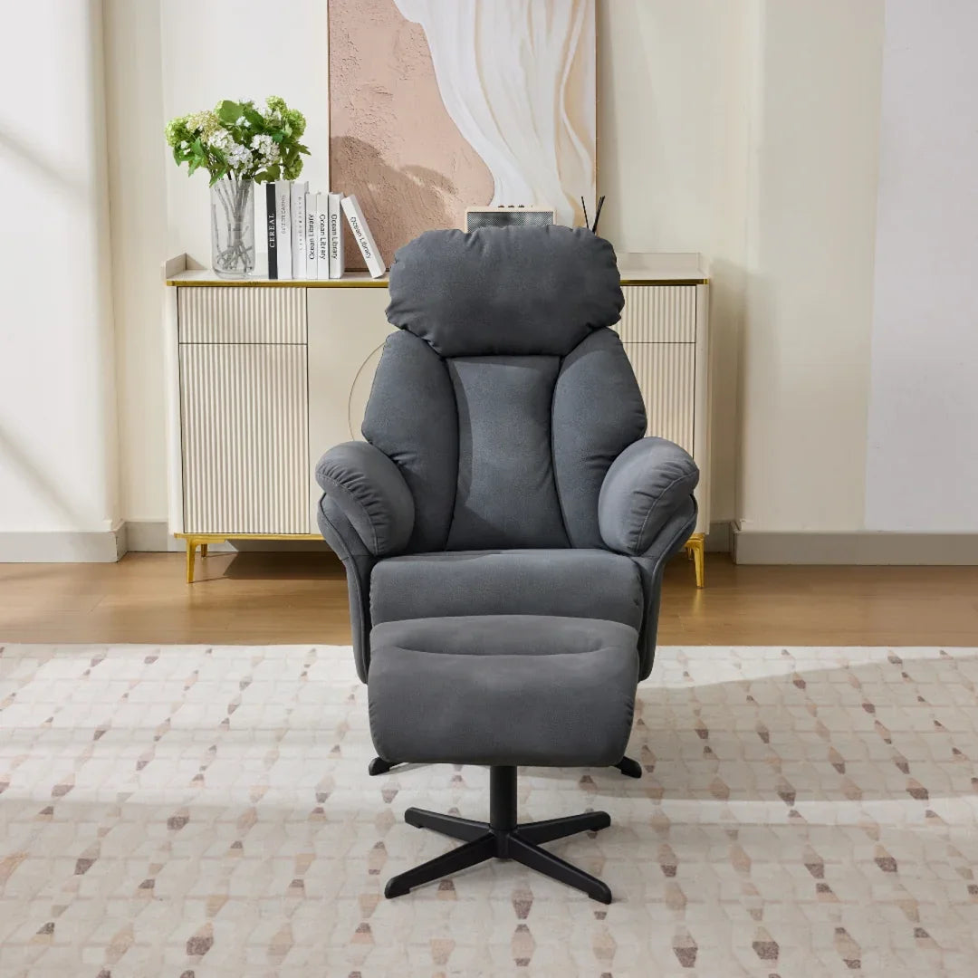 Dark grey swivel leisure chair with matching footstool on patterned rug