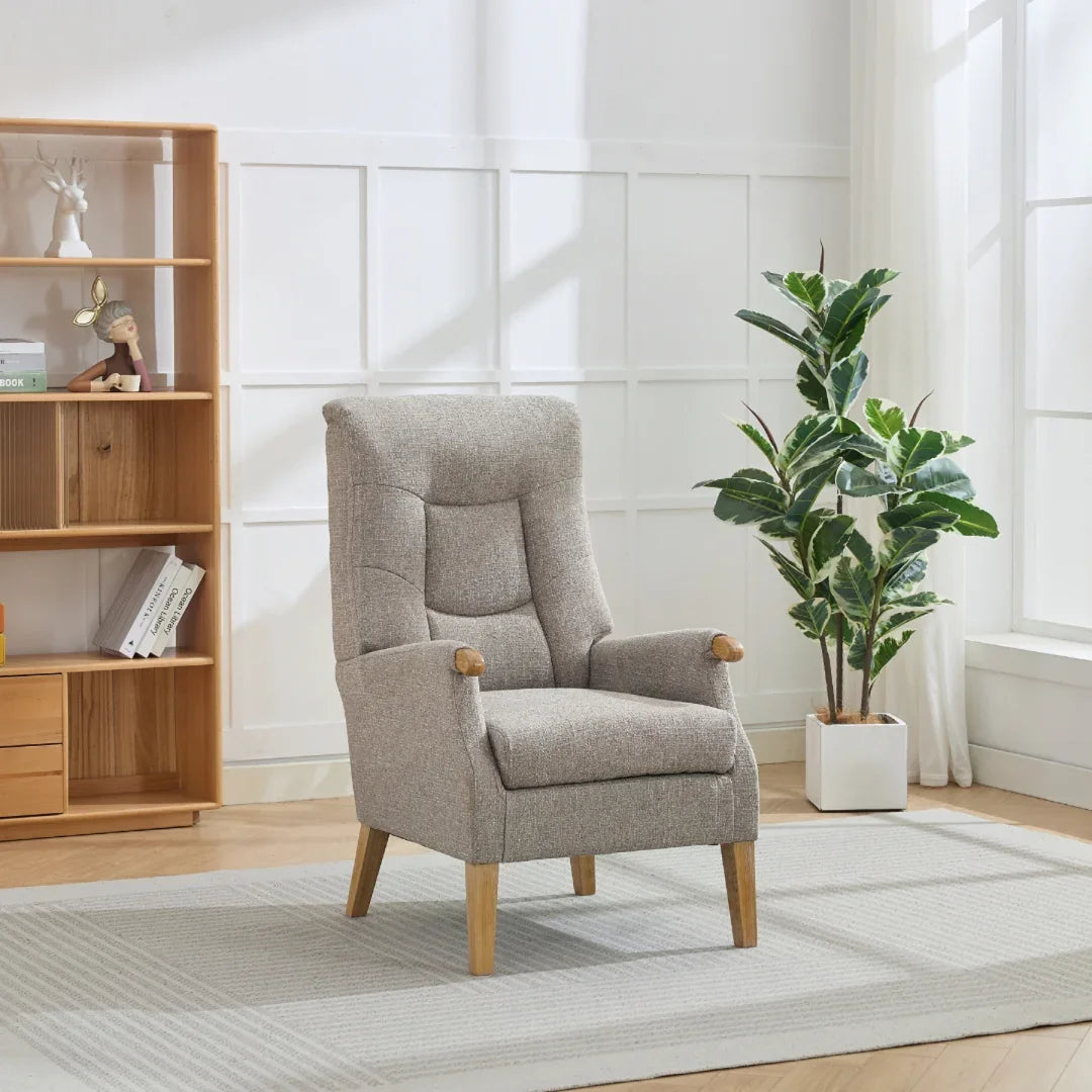 Beige upholstered accent chair with wooden legs in modern living room setting