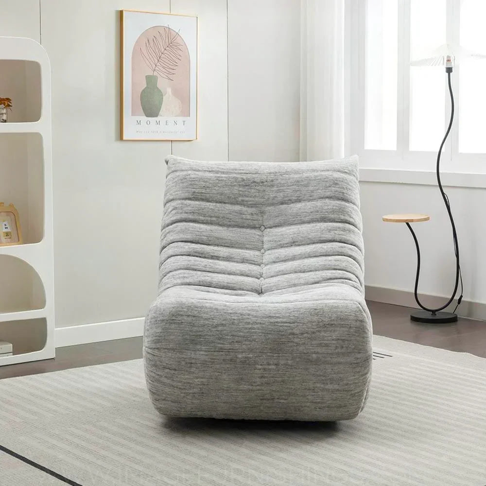 Grey reclining chair with soft fabric upholstery in modern living room setting