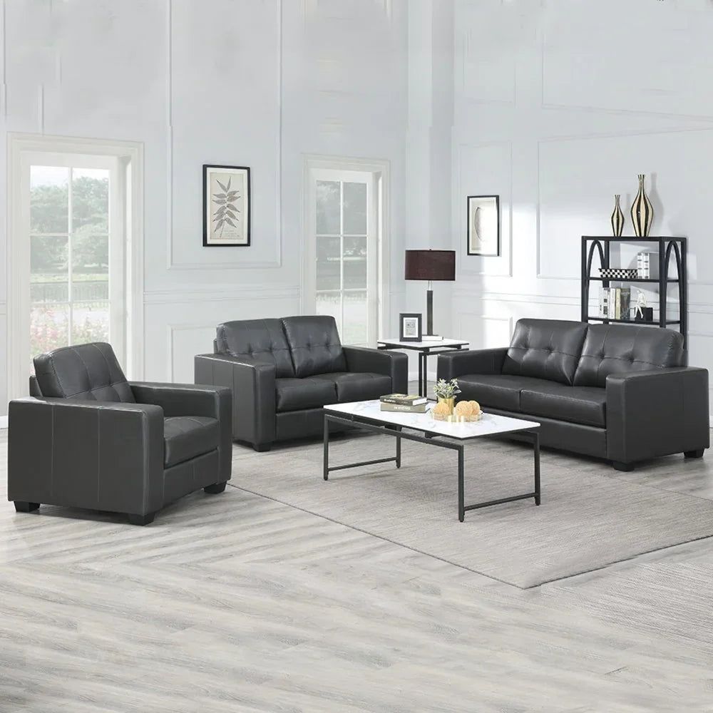 Black three-seater sofa with tufted backrest, set in a bright living room with modern decor