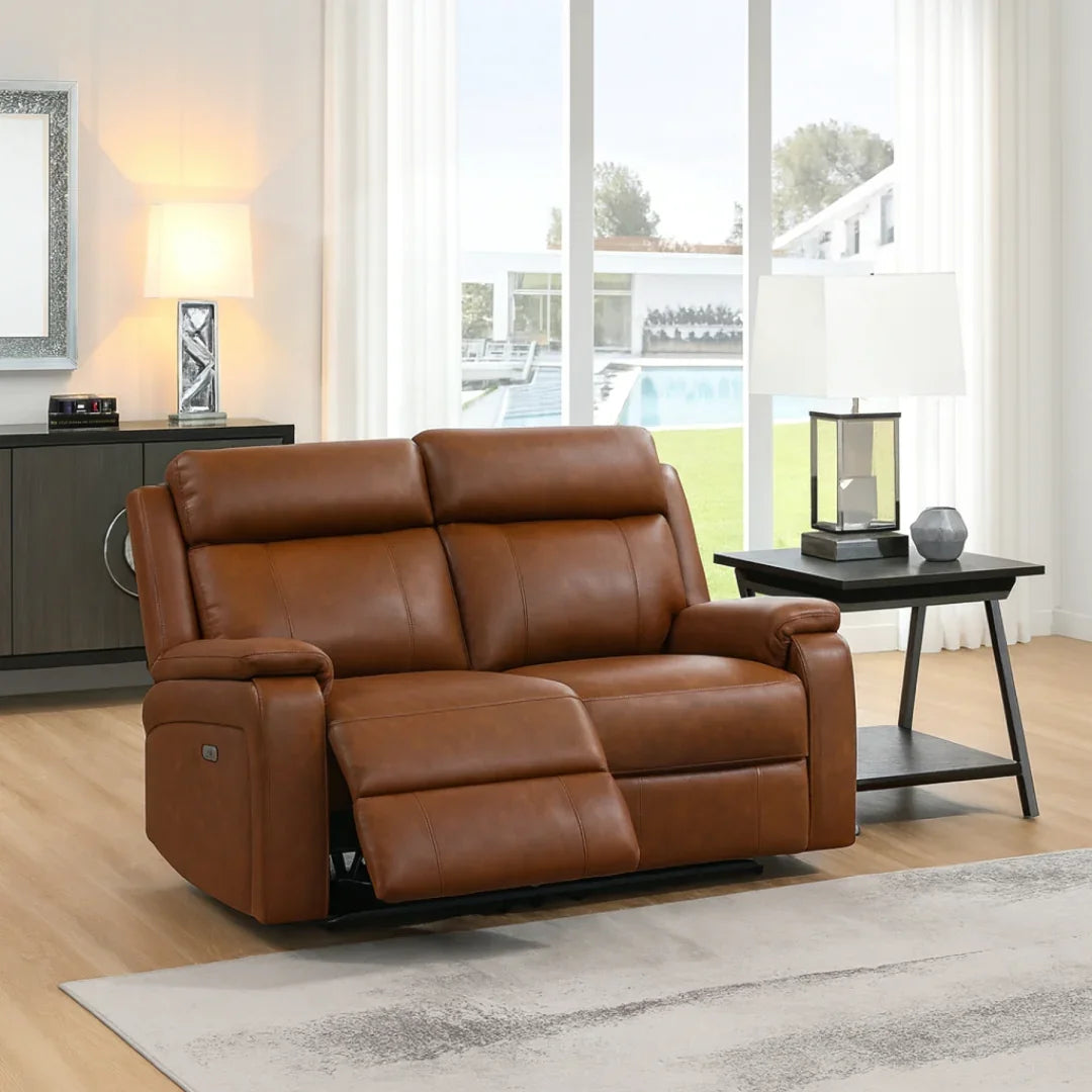 Bison saddle leather loveseat recliner with padded arms in bright living room setting