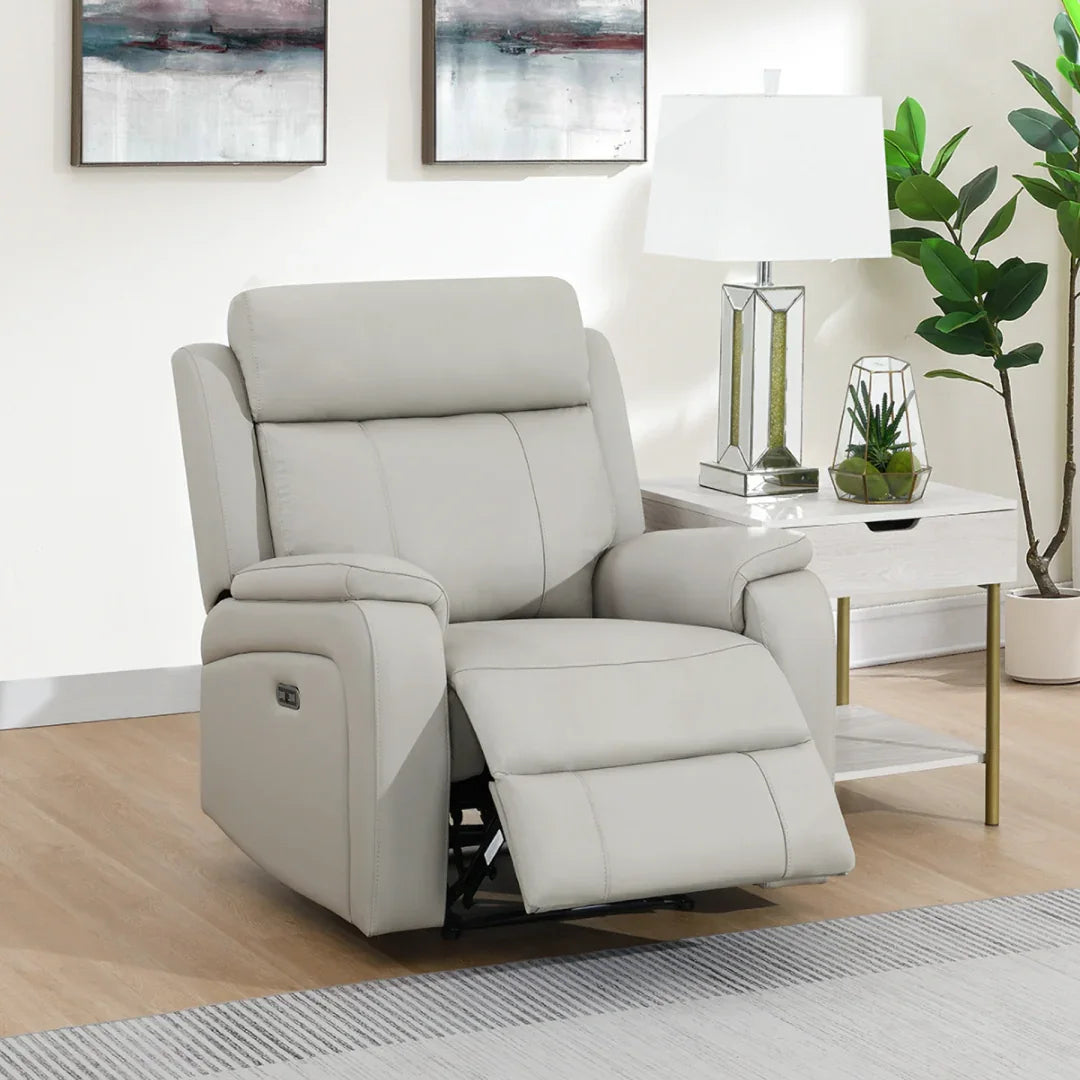 Light grey leather armchair recliner with padded seat and backrest in modern living room