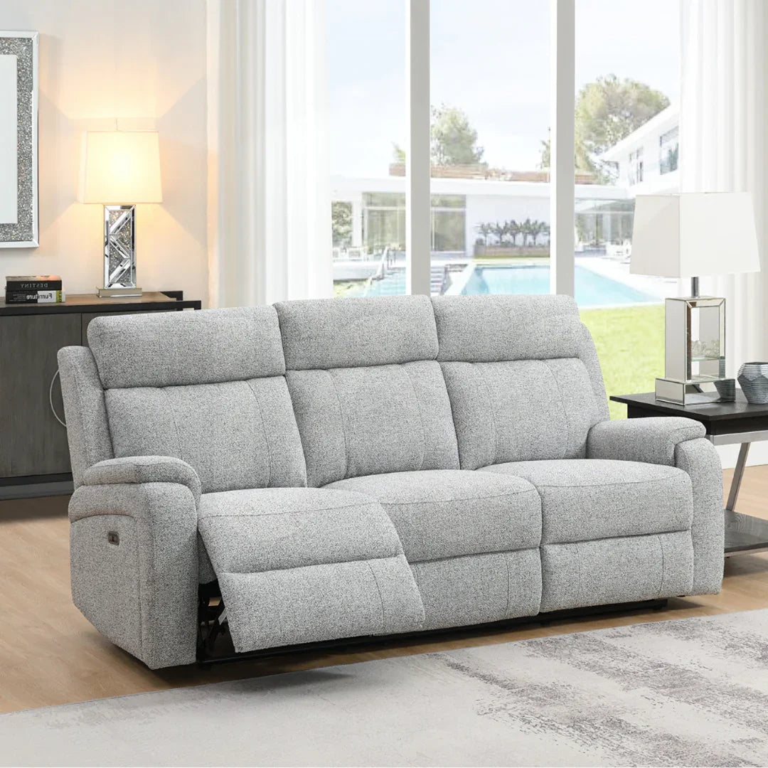 Silver three seater recliner sofa with textured fabric in modern living room setting