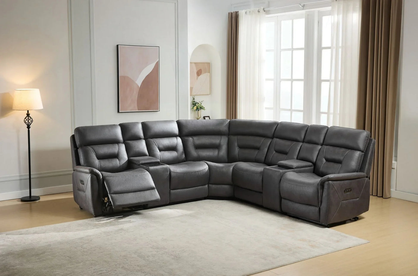 Grey sectional sofa with chaise and recliner, cup holders, in modern living room setting