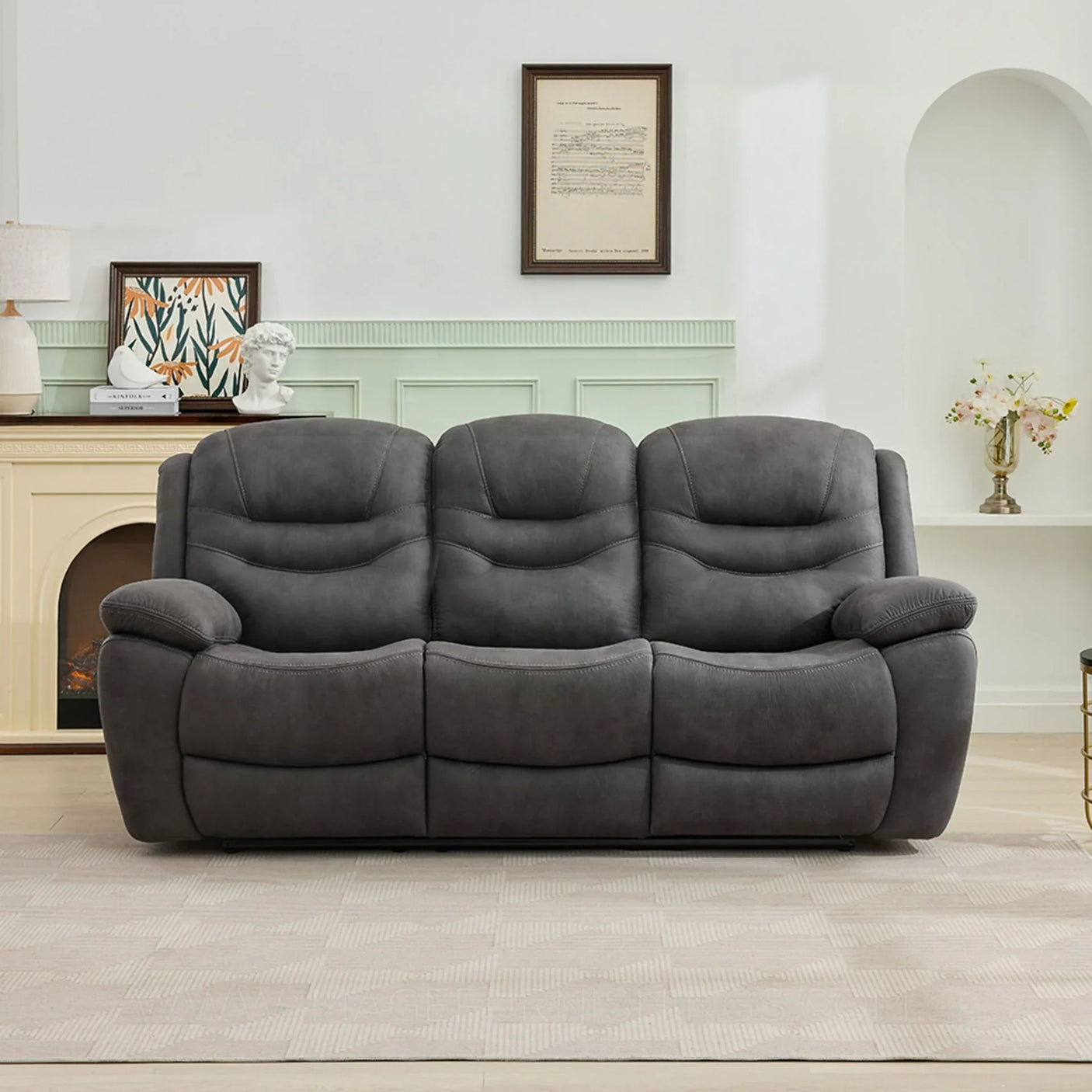 Gunmetal three seater sofa with plush cushions in a modern living room setting