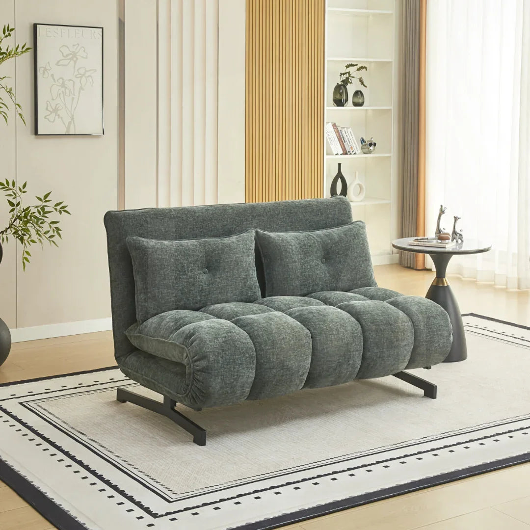 Double sofa bed in winter moss fabric set on a modern rug in a bright living room