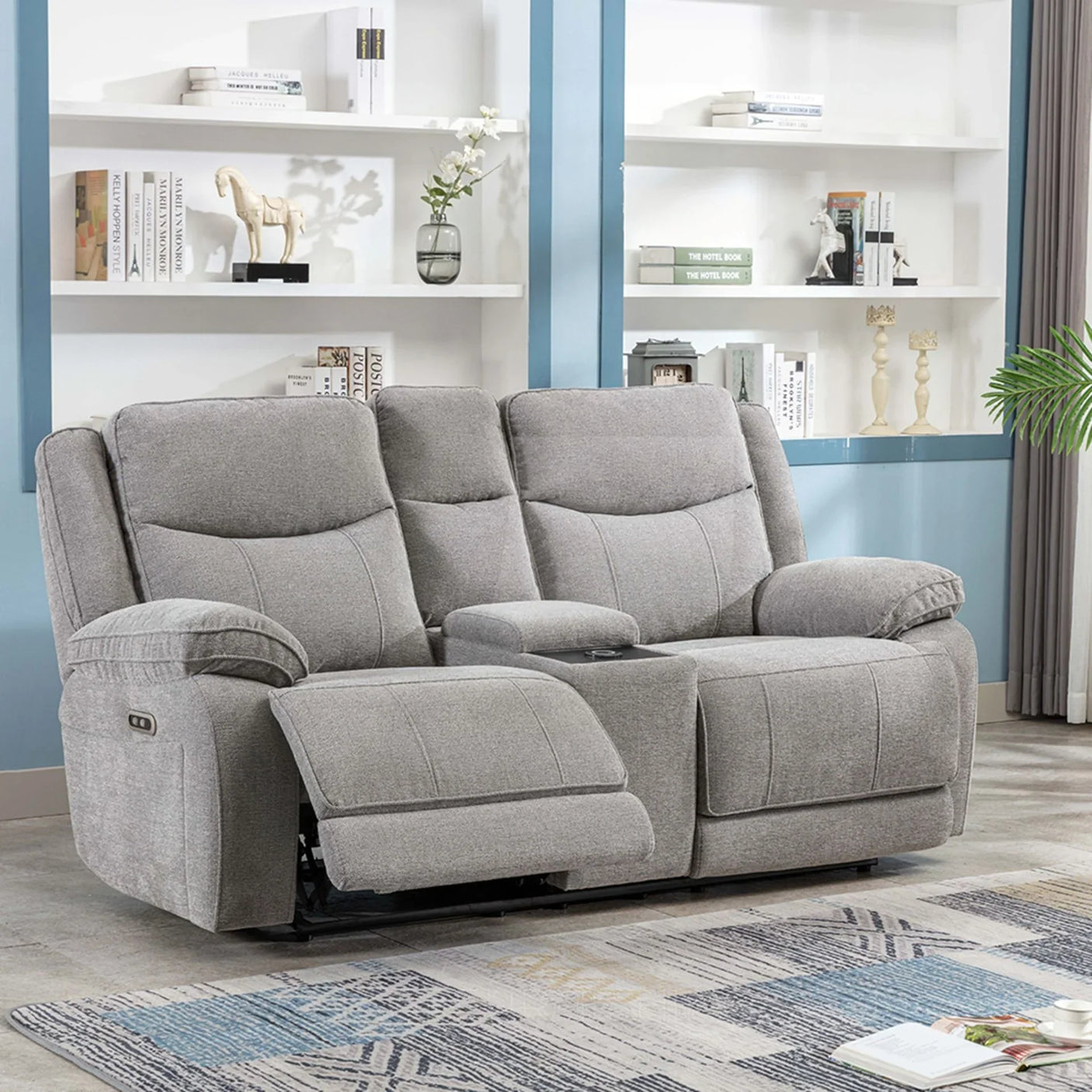 Light grey electric recliner sofa with center console and wireless charger in living room
