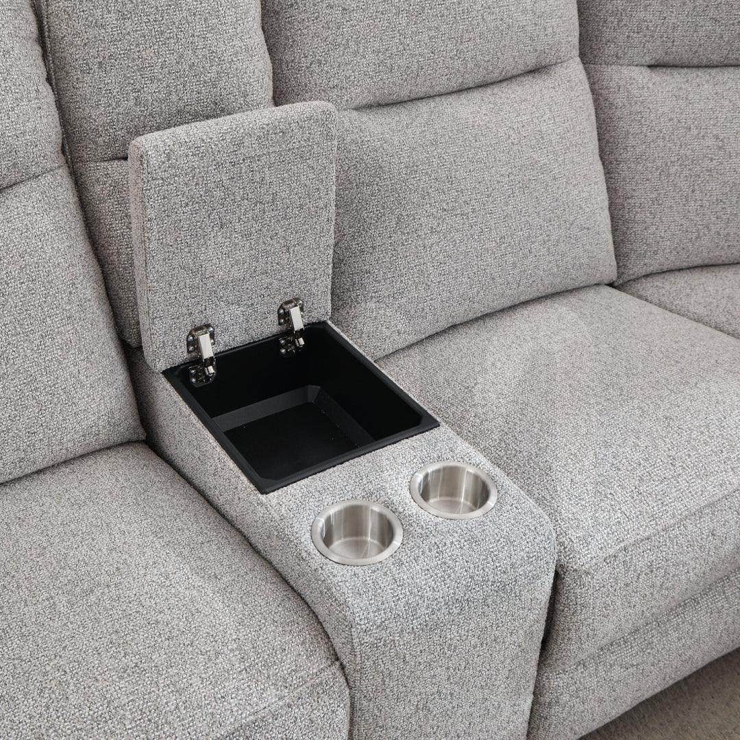 Light grey fabric sofa with central console, storage compartment, and dual cup holders