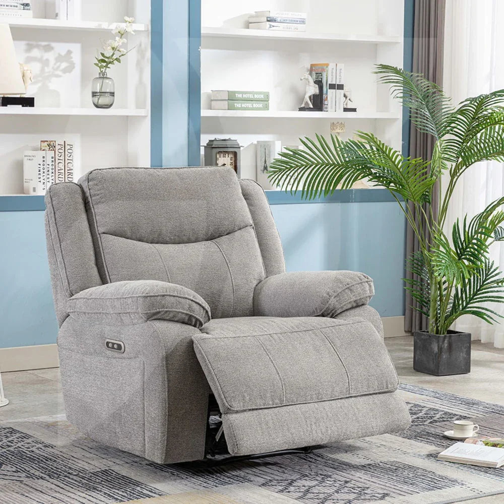 Grey fabric recliner armchair with padded arms and extended footrest in modern living room