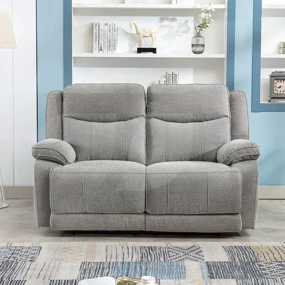 Grey fabric 2 seater sofa with padded arms and cushions in modern living room setting