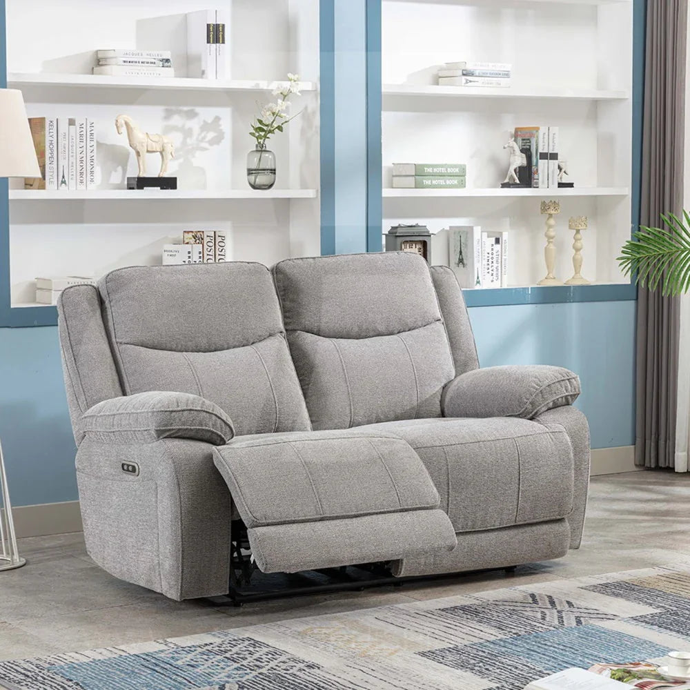 Light grey fabric two-seater recliner sofa with padded arms in modern living room