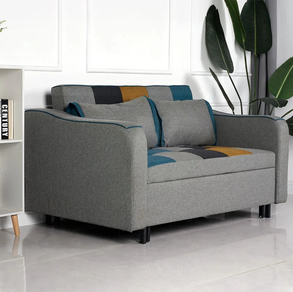 Grey fabric sofa with yellow and blue patchwork cushions in modern living room setting