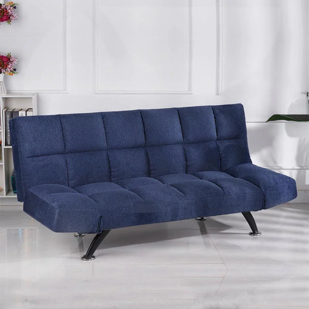 Denim blue sofa bed with tufted upholstery and black metal legs in a modern living room