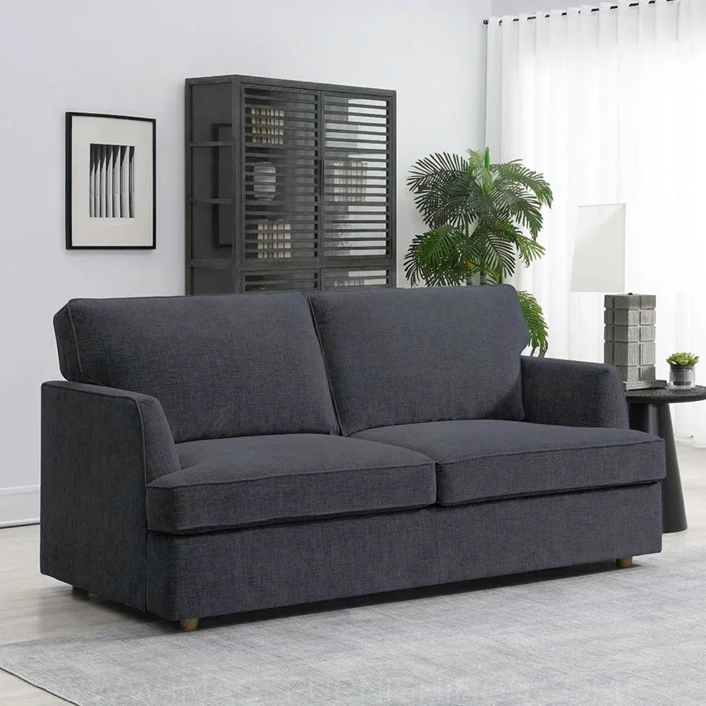Dark grey fabric sofa bed with winged back in modern living room setting
