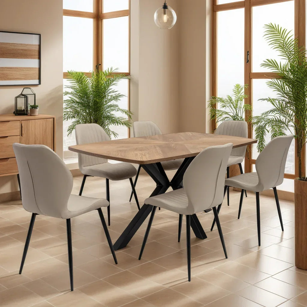 Wood dining table set with six modern beige chairs in a bright room with large windows