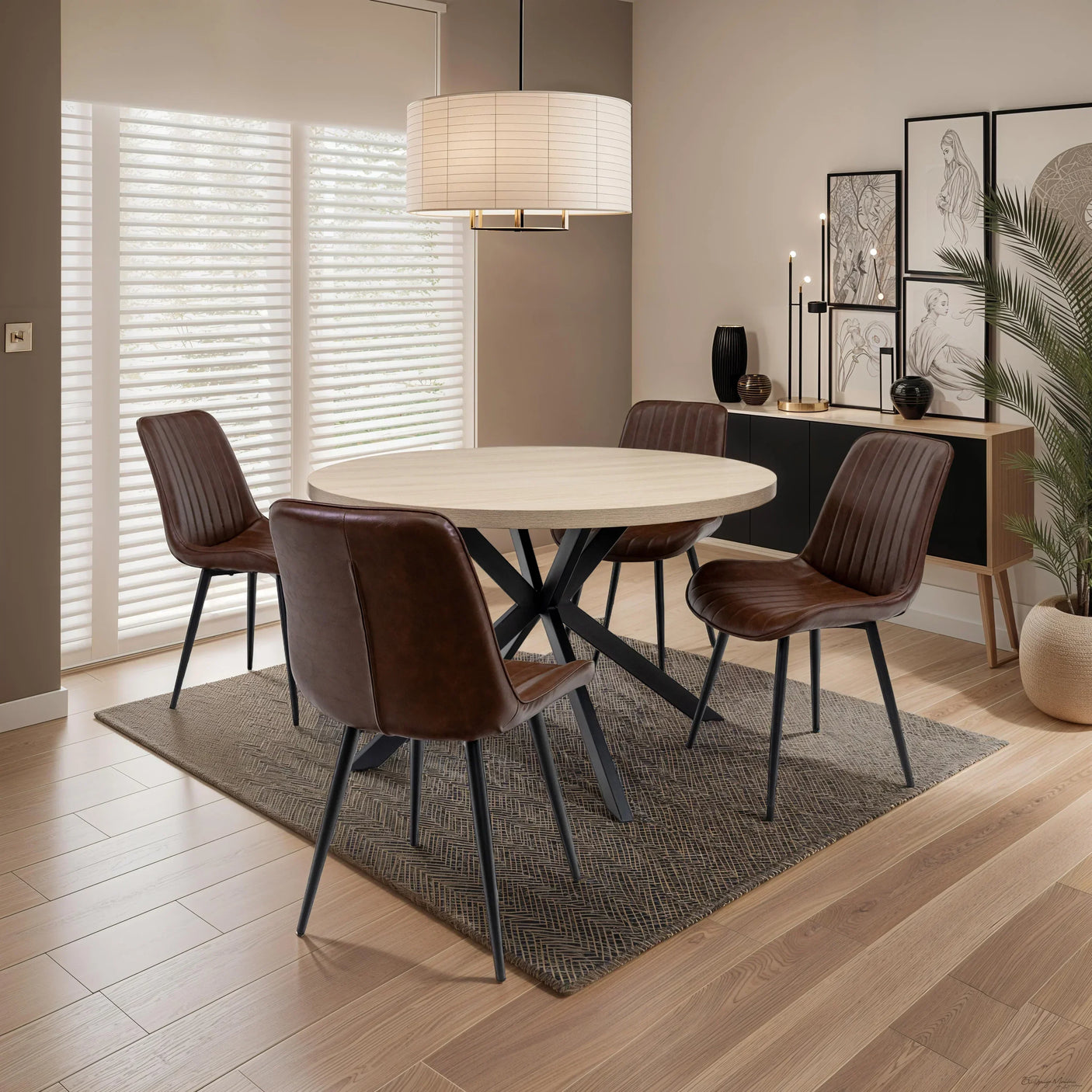 Round wooden dining table with four brown leather chairs in modern dining room