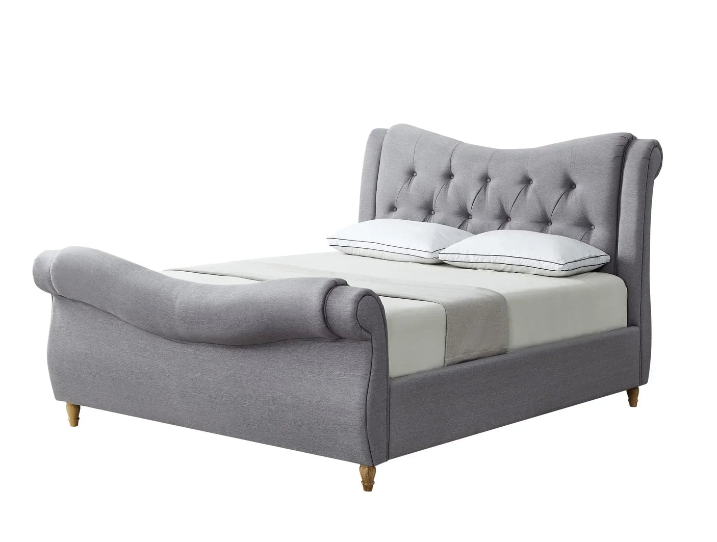 Grey upholstered bed frame with tufted headboard and curved footboard on wooden legs