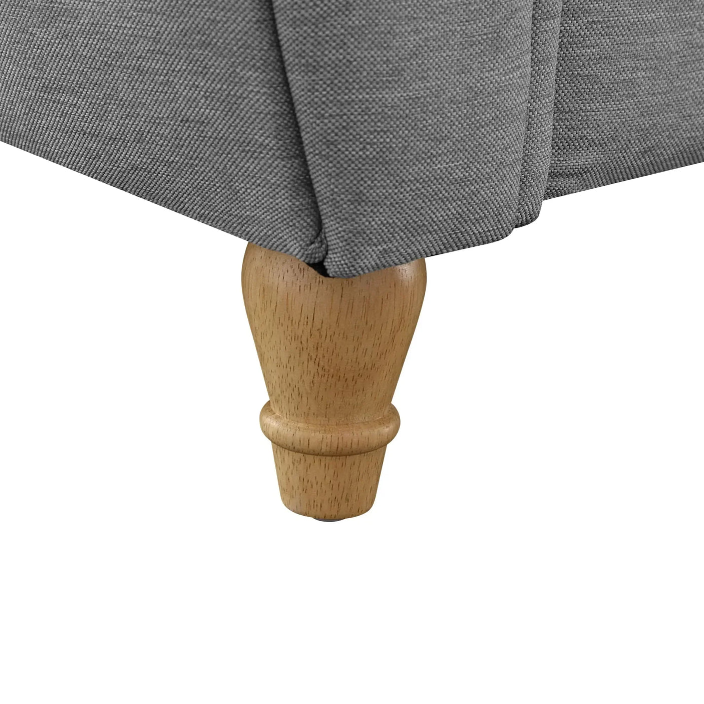 Close-up of sofa wooden leg with grey fabric upholstery