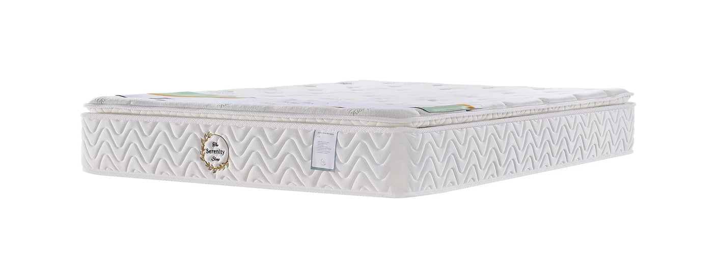 White memory foam mattress with quilted cover and side labels, angled side view