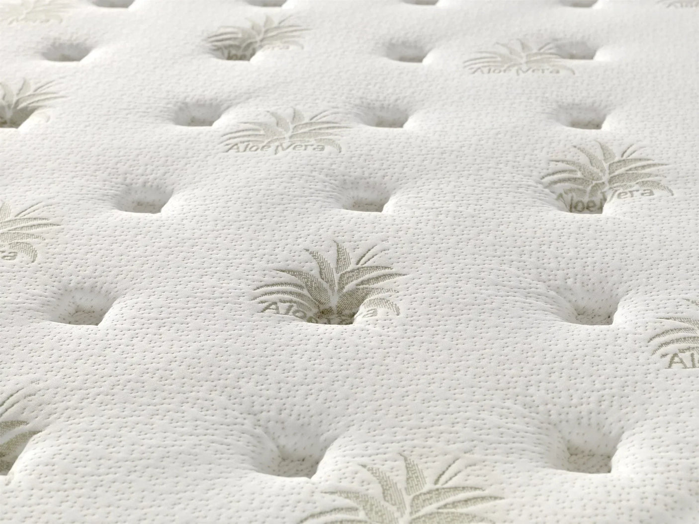 Close up of aloe vera mattress surface with quilted detail and embossed pattern