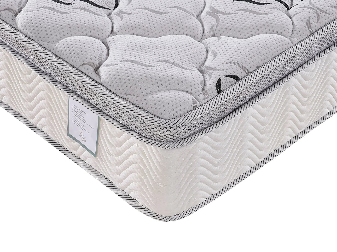 quilted mattress corner with textured white fabric and grey piping detail