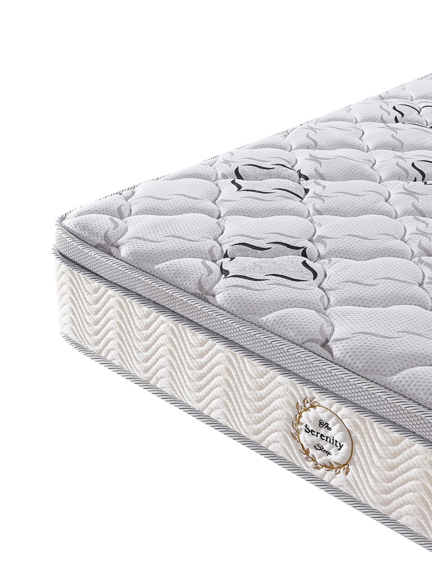 Quilted white mattress with wave pattern side panel and stitched Serenity Sleep label