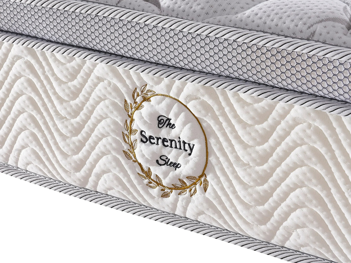 White quilted mattress with wave pattern detail and gold leaf embroidery on side panel