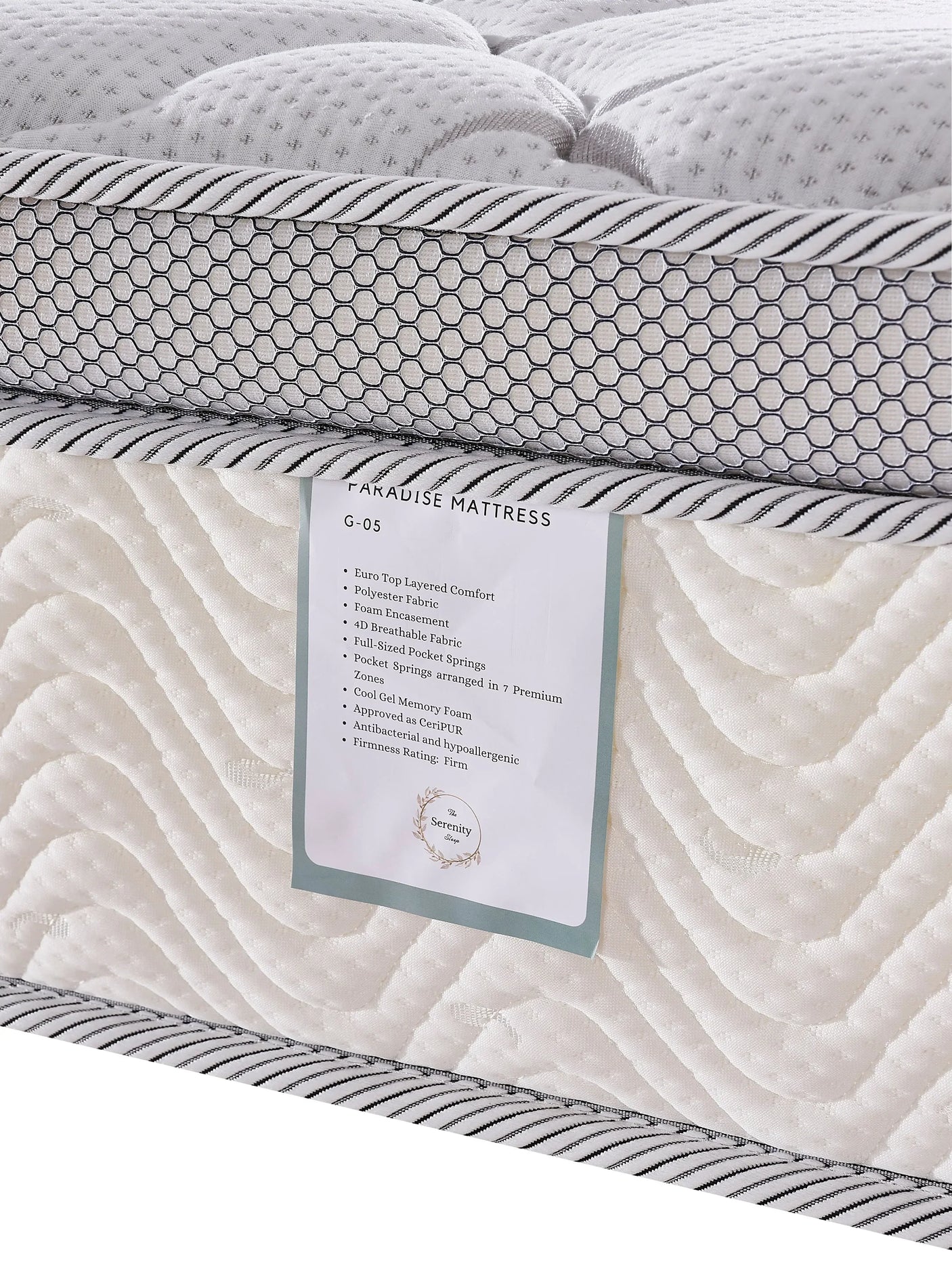 Closeup of Paradise mattress euro top with honeycomb side panel and product label
