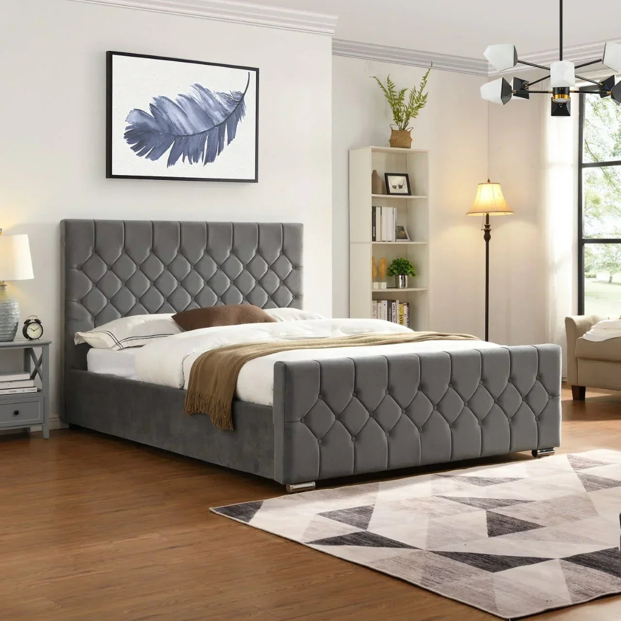 Grey upholstered bed with diamond tufted headboard and footboard in modern bedroom setting