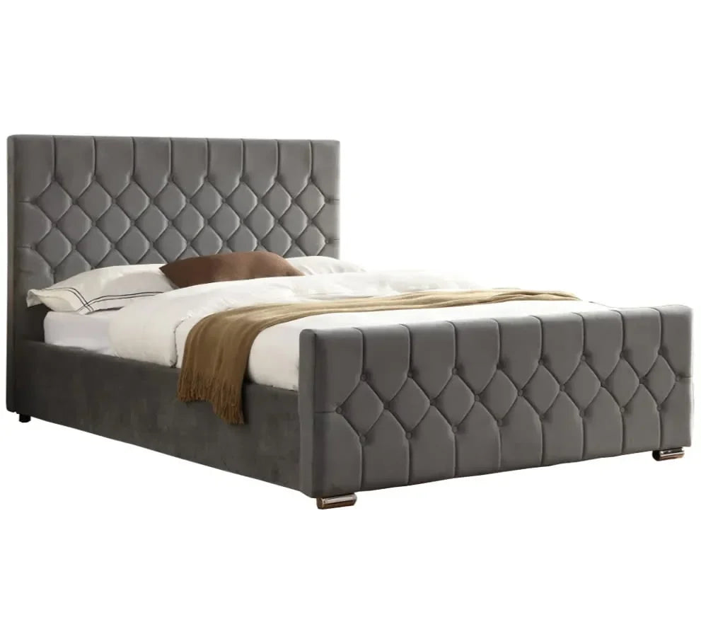 Grey velvet bed frame with quilted headboard and footboard, bedding and cushions