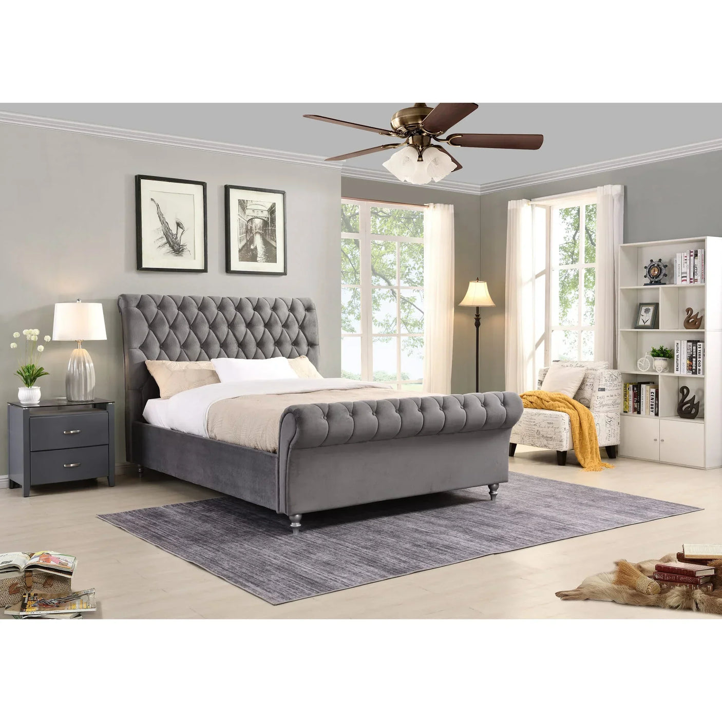 Grey velvet upholstered bed frame with tufted headboard in bright bedroom setting
