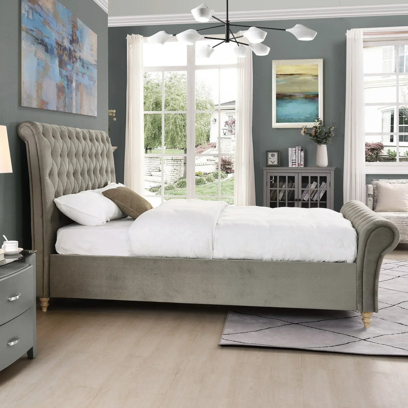 Grey upholstered bed with tufted headboard in modern bedroom