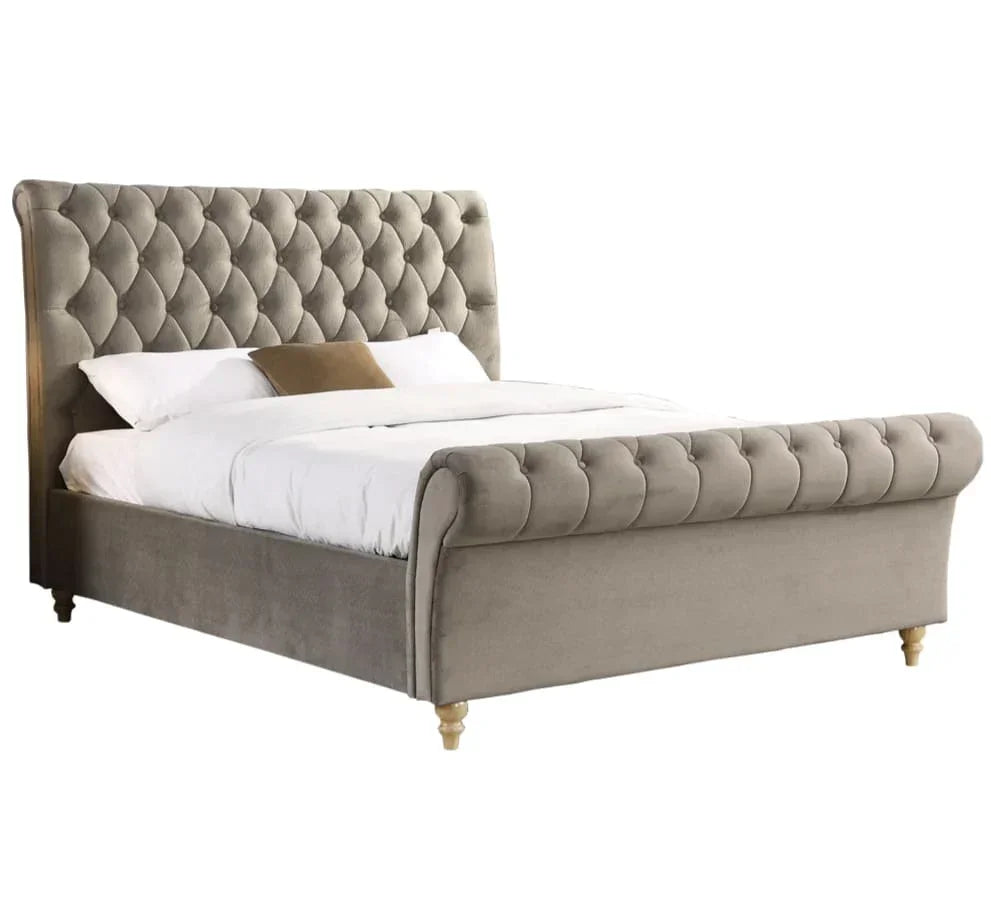 Grey upholstered bed frame with button-tufted headboard and footboard on wooden legs