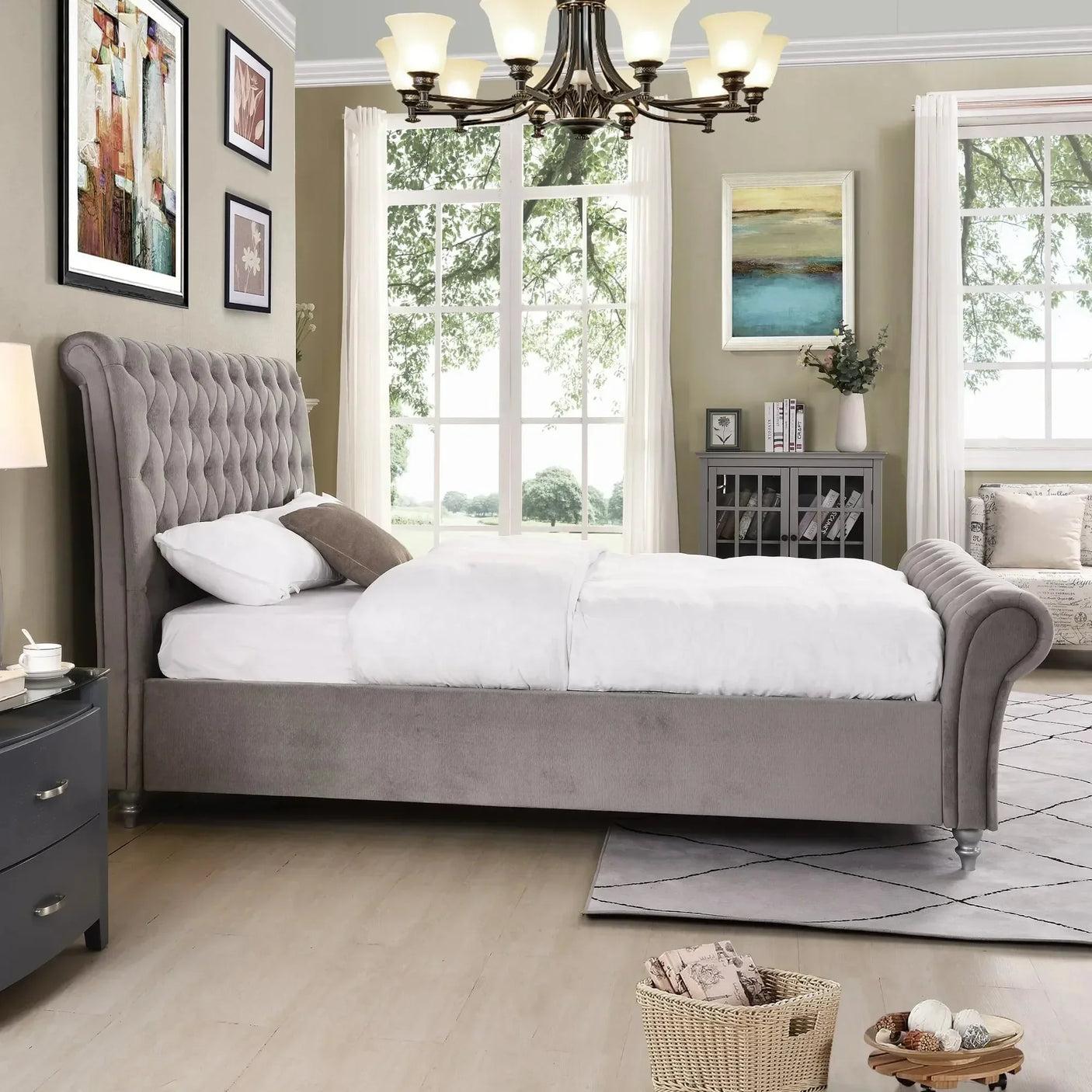 Grey upholstered bed with button tufted headboard in modern bedroom with large window