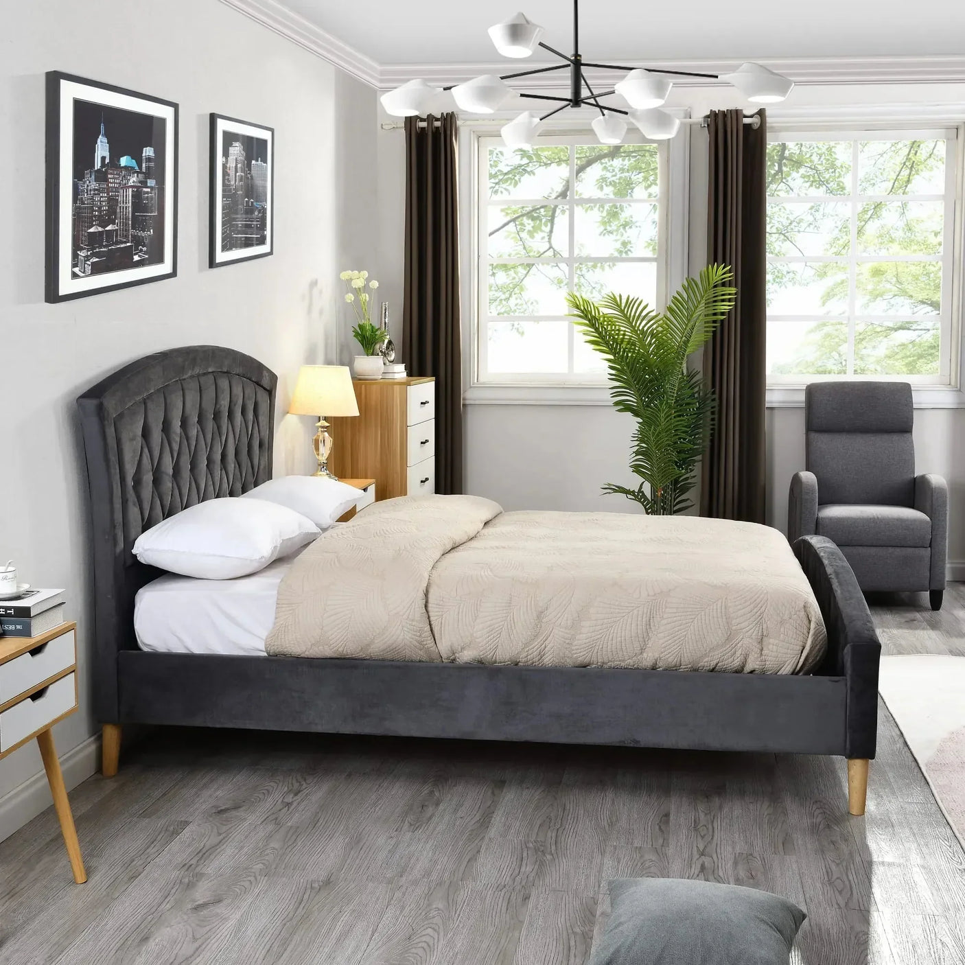 Grey velvet bed frame with tufted headboard in modern bedroom with wood flooring