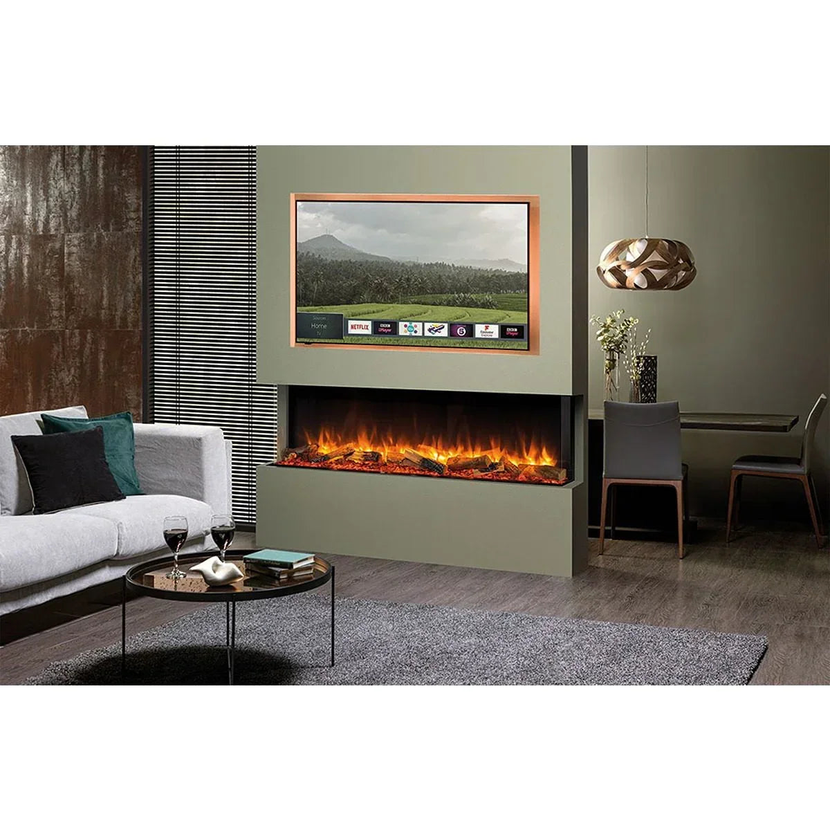 Modern living room with electric fireplace, grey sofa, wall-mounted TV, and dining table
