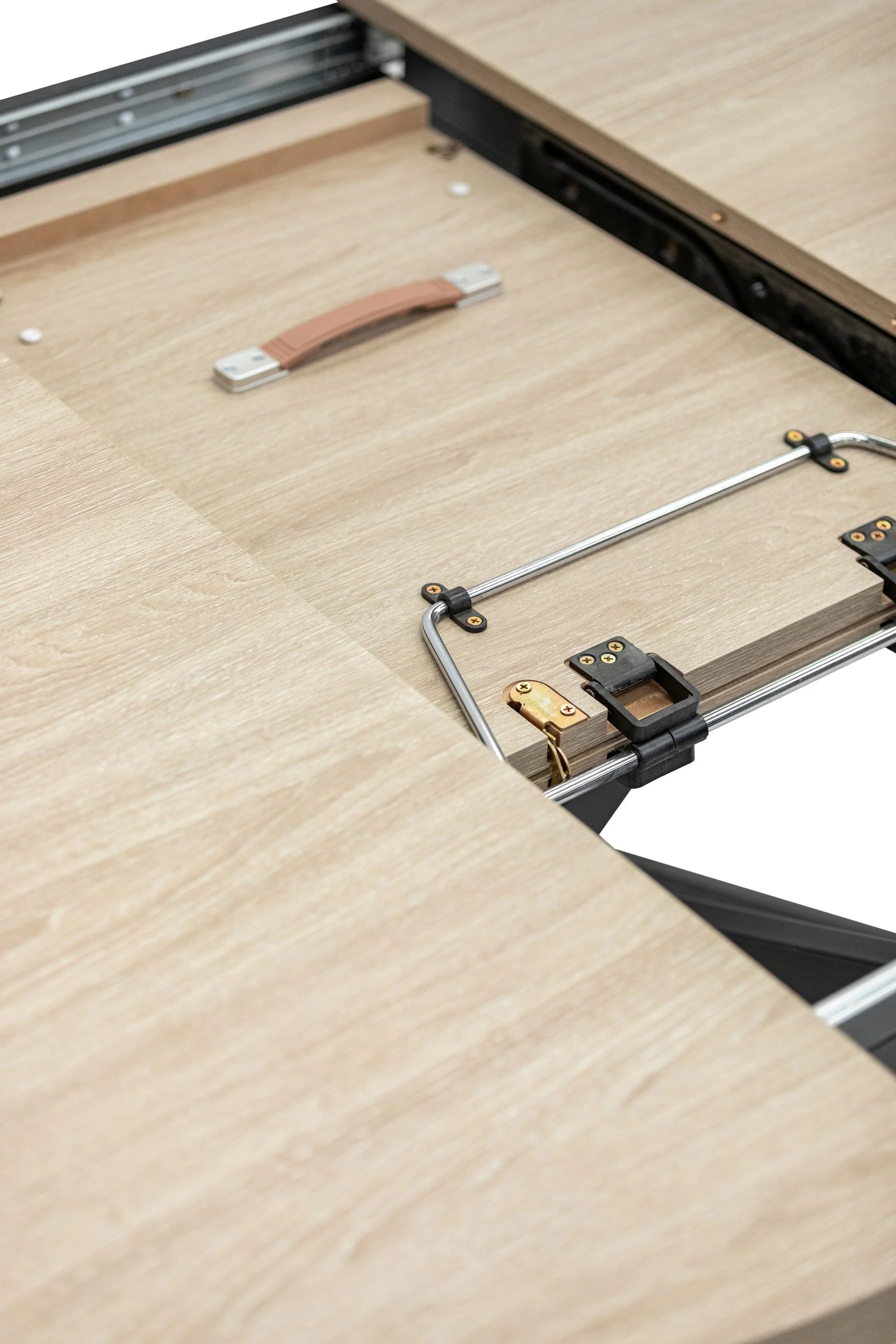 Light oak extendable dining table mechanism with metal fittings and wood panels